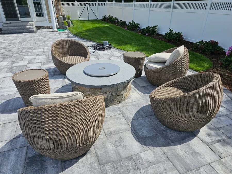 Fire pit with wicker lounge chairs on the patio
